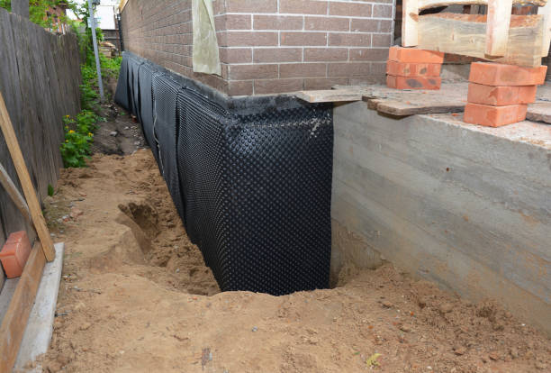 Happy homeowners after waterproofing job in Montgomery